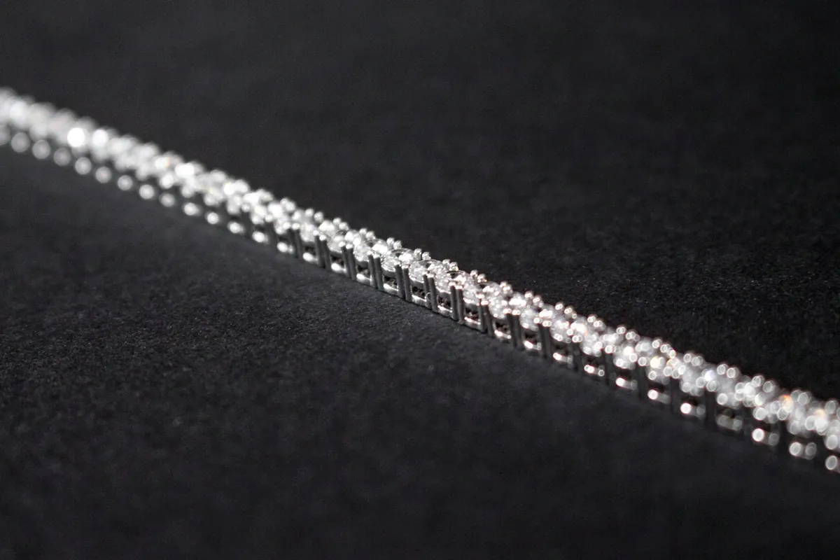 Diamond tennis bracelet on black fabric