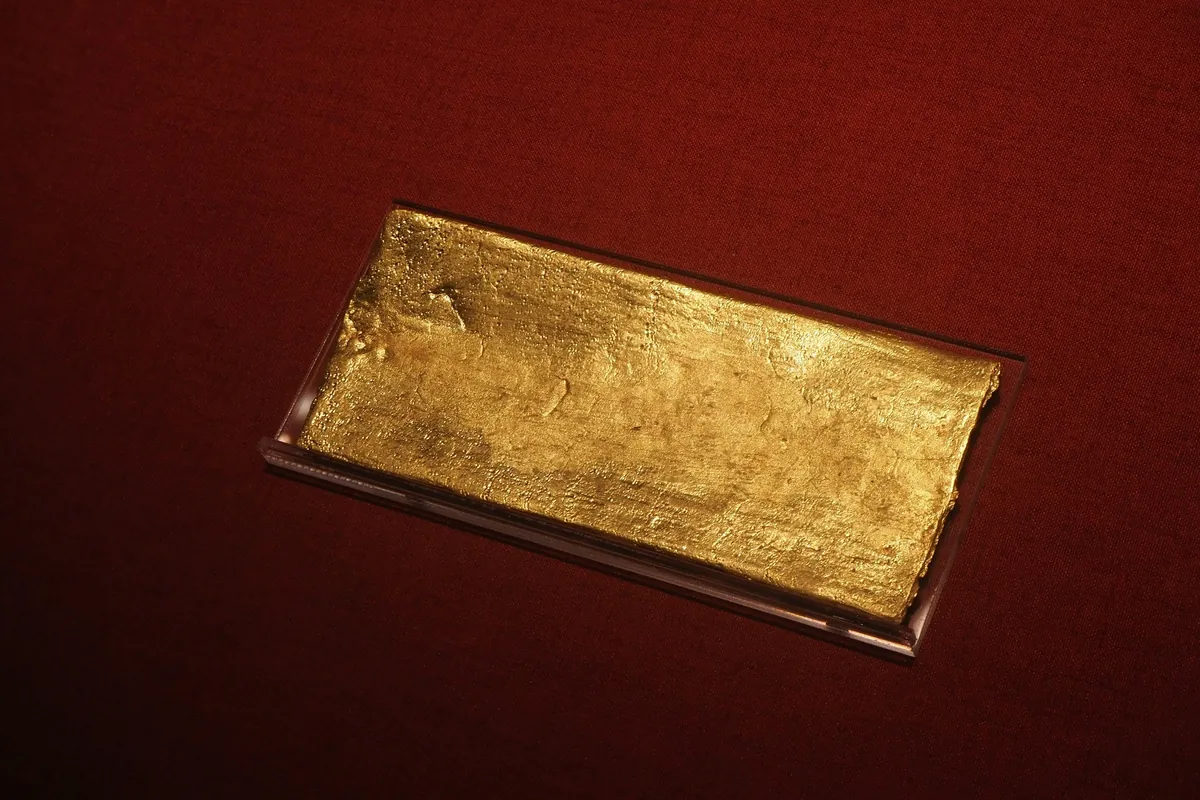 Gold bar on deep red cloth